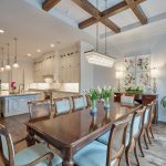 Traditional Dining Room Design with Wood Beams and Colorful Custom Drapes