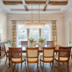 Traditional Dining Room Design with Wood Beams and Colorful Custom Drapes